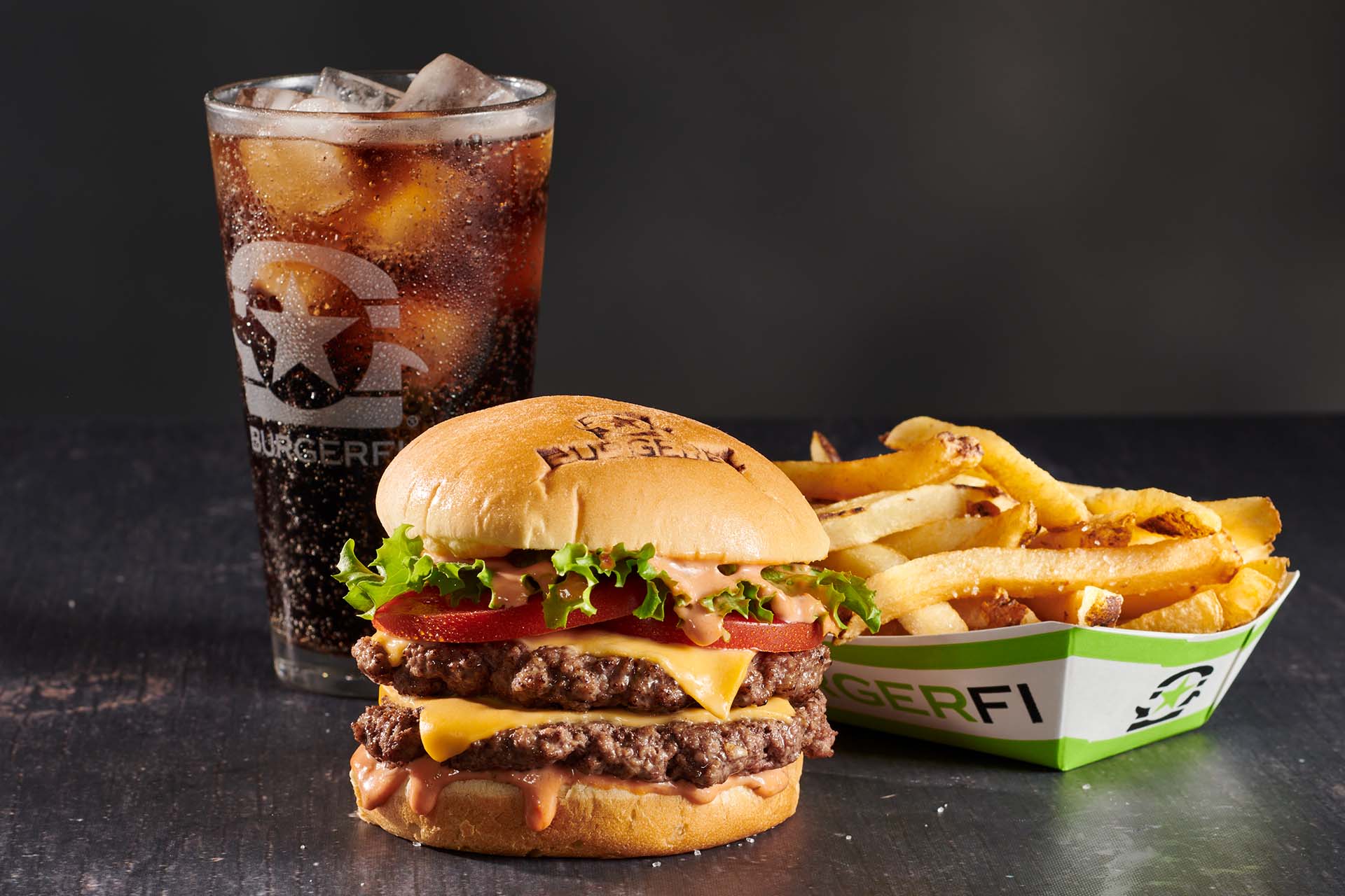 BurgerFi cheeseburger combo with fries and a cola