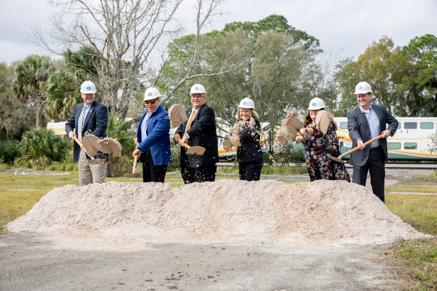 Leaders and developers, from left, Florida Department of Transportation District Five Secretary John Tyler, developer Art Falcone, City Manager Carmen Rosamonda, Mayor Karen Chasez and developers Roxanne Williams and Terry Wayland break ground on the new DeBary Main Street district on Jan. 24, 2024. (Patrick Connolly/Orlando Sentinel)