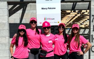 Marcy Falcone with her daughters-in-law, Anna, Ashley, Jaclyn, and Lauren Munzo, participate in the largest Habitat for Humanity village build in the United States.