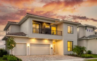 Luxury home with balcony and two-car driveway and garage