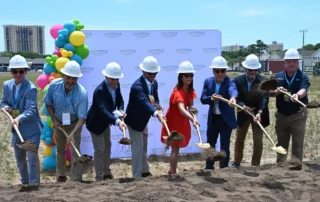 South Carolina Lieut. Gov. Pamela Evette (in red) and other dignitaries shovel ceremonial dirt at the groundbreaking Saturday for Margaritaville Vacation Residences in Myrtle Beach. (Mike Duprez/MyHorryNews)