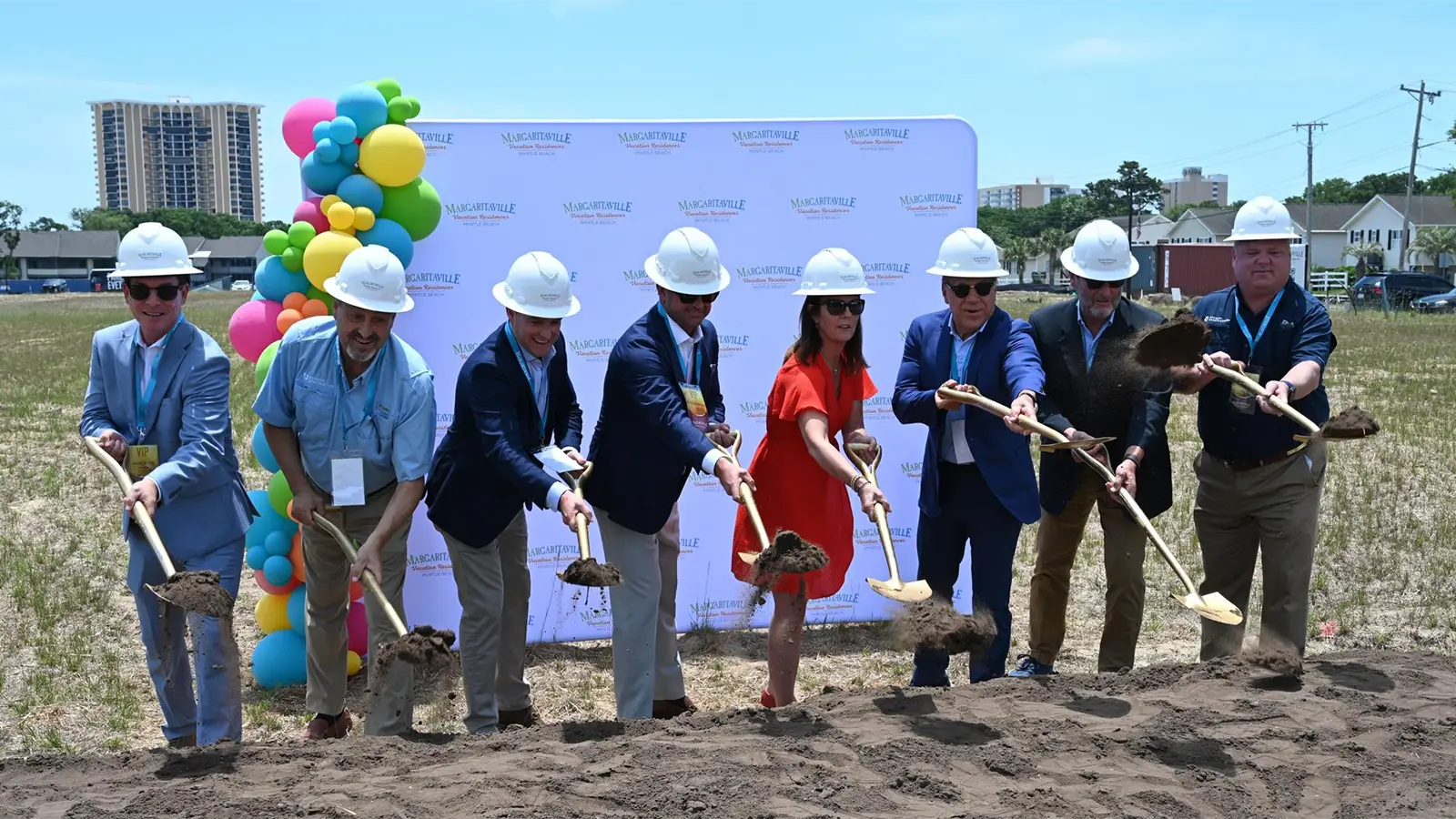 South Carolina Lieut. Gov. Pamela Evette (in red) and other dignitaries shovel ceremonial dirt at the groundbreaking Saturday for Margaritaville Vacation Residences in Myrtle Beach. (Mike Duprez/MyHorryNews)